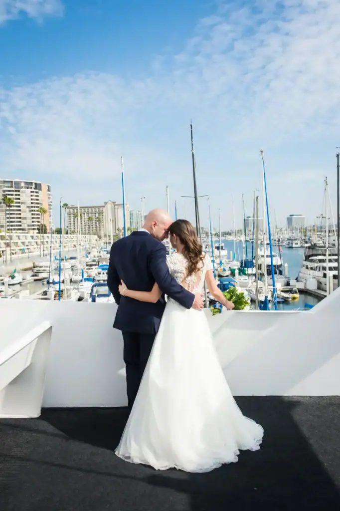 Bride and groom share a moment during a yacht wedding in Marina del Rey