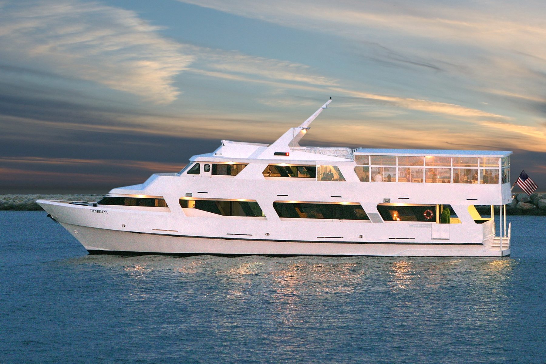 The Dandeana yacht on the water at sunset