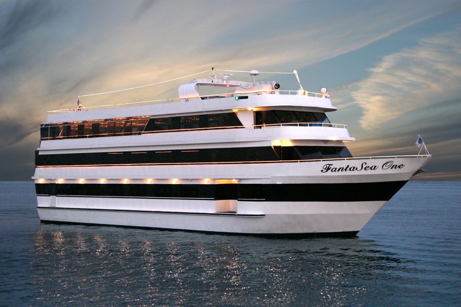 The FantaSea One yacht on the water at dusk